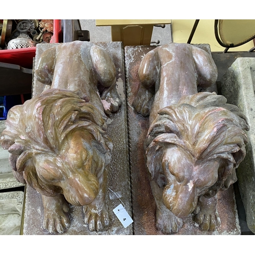 4 - A pair of faux terracotta resin recumbent lion garden ornaments, length 74cm, width 36cm, height 50c... 