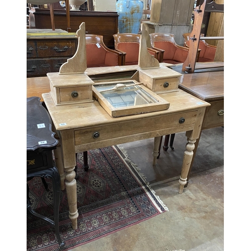 53 - A Victorian pine dressing table, width 91cm, depth 47cm, height 130cm (mirror lacks fixings)... 