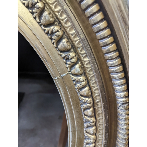 1142 - A large Regency circular giltwood and gesso convex wall mirror, diameter 86cm