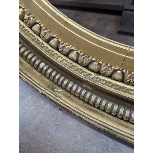 1142 - A large Regency circular giltwood and gesso convex wall mirror, diameter 86cm