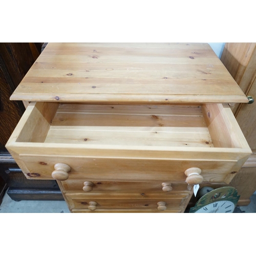 23 - A small modern pine five door chest, width 69cm, depth 40cm, height 106cm