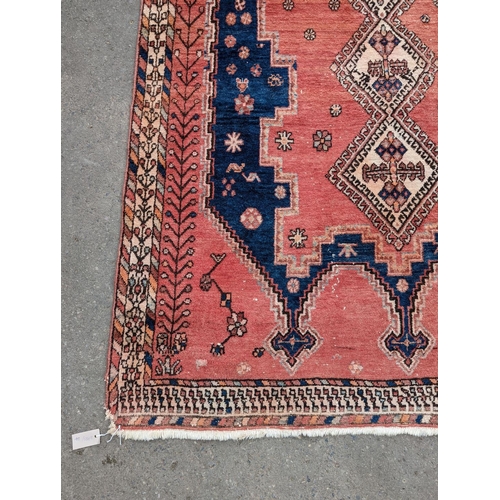 27 - A Caucasian style blue ground geometric rug, 215 x 155cm