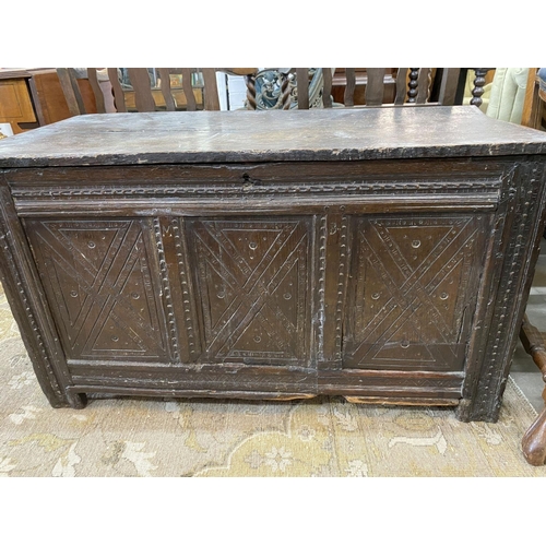 39 - A 17th century carved oak coffer, length 110cm, depth 52cm, height 61cm