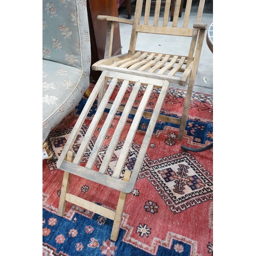 42 - A weathered teak folding garden steamer chair