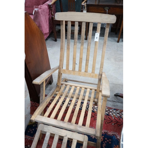 42 - A weathered teak folding garden steamer chair