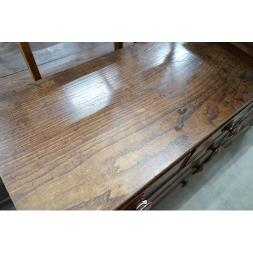 47 - An early 19th century provinical oak chest of two short and three long drawers, width 93cm, depth 48... 