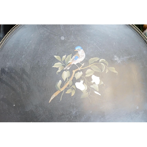 52 - A Victorian circular gilt metal mounted ebonised centre table with pietra dura top, diameter 57cm, h... 