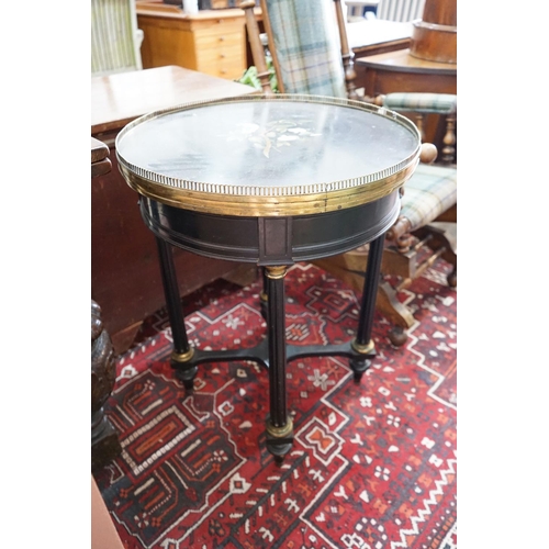 52 - A Victorian circular gilt metal mounted ebonised centre table with pietra dura top, diameter 57cm, h... 