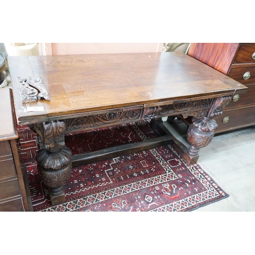 62 - A 17th century style rectangular oak draw leaf dining table on carved baluster legs, 275cm extended,... 