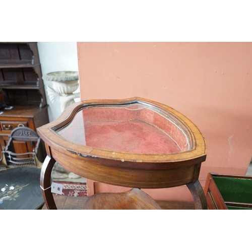 63 - An Edwardian mahogany shield shaped bijouterie table, width 50cm, depth 59cm, height 72cm... 