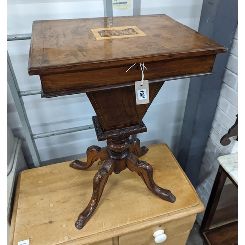 65 - A Victorian walnut trumpet work table, the hinged top inset with a Tunbridge inlaid view of Eridge C... 