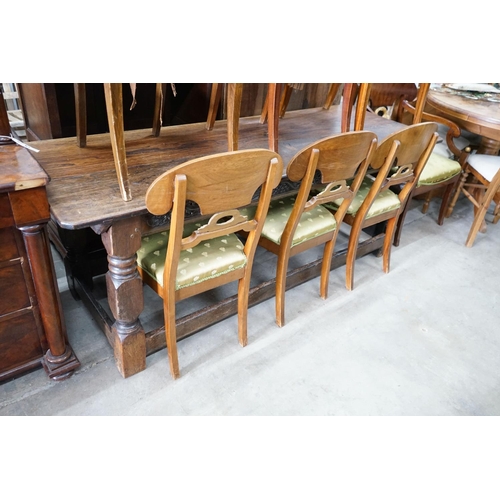 68 - A set of eight Swedish Biedermeier birch with mahogany veneer, wreath design dining room chairs, inc... 