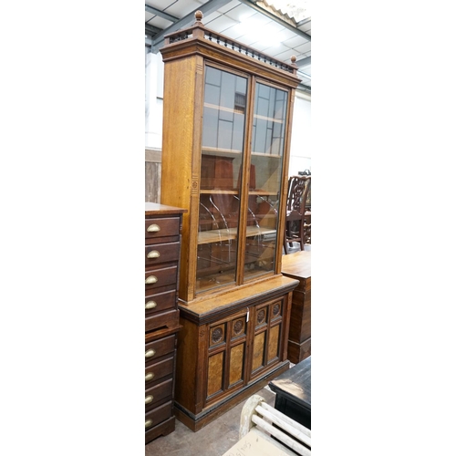 1006 - A late Victorian Aesthetic movement oak and pollard oak bookcase, width 114cm depth 50cm height 262c... 