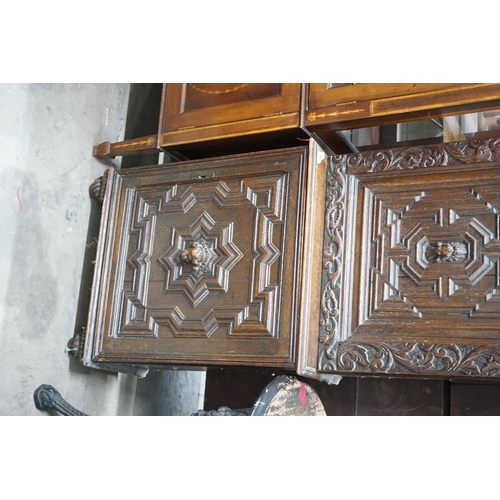 1018 - A carved oak narrow cupboard, width 60cm depth 28cm height 176cm