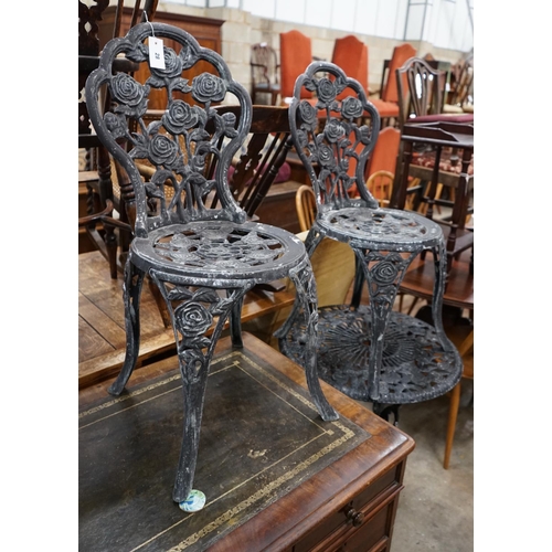 1028 - A painted aluminium circular garden table and two chairs, table diameter 59cm height 68cm... 