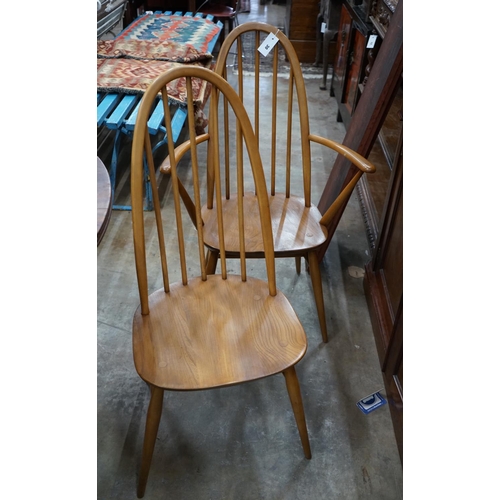 1030 - A set of six Ercol elm and beech comb back dining chairs, two with arms