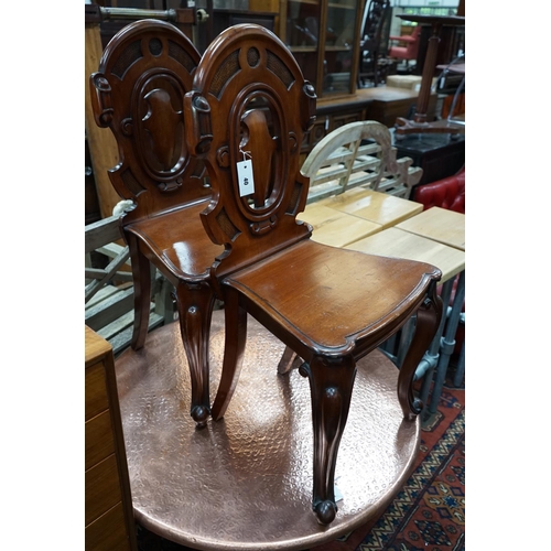 1040 - A pair of Victorian mahogay hall chairs