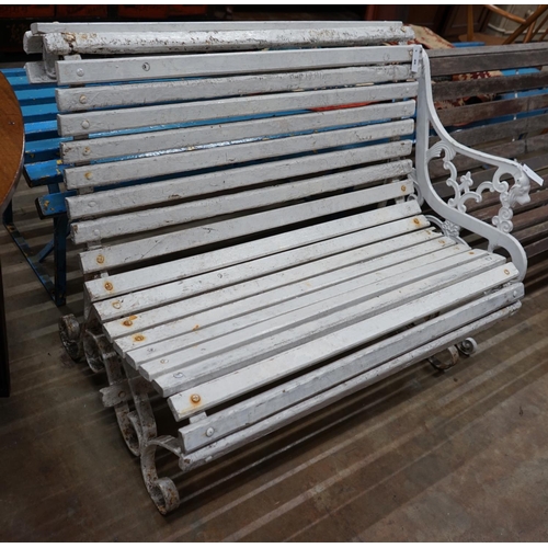 1045 - A painted slatted wood and wrought iron garden bench, length 106cm depth 74cm height 84cm... 