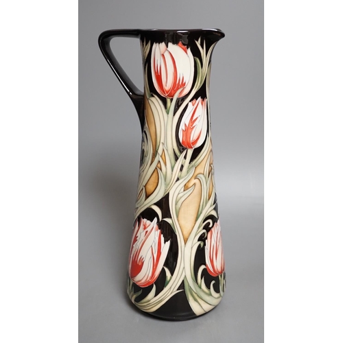 1426 - A Moorcroft 'race against time' jug by Paul Hilditch, limited edition 11/40, boxed,31 cms high.... 