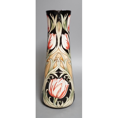 1426 - A Moorcroft 'race against time' jug by Paul Hilditch, limited edition 11/40, boxed,31 cms high.... 