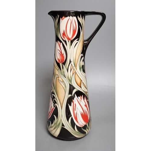 1426 - A Moorcroft 'race against time' jug by Paul Hilditch, limited edition 11/40, boxed,31 cms high.... 