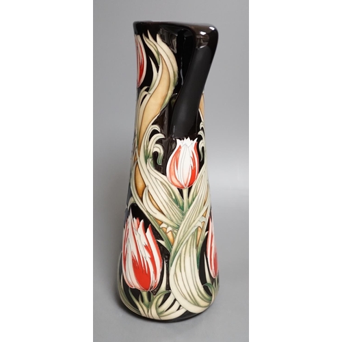 1426 - A Moorcroft 'race against time' jug by Paul Hilditch, limited edition 11/40, boxed,31 cms high.... 