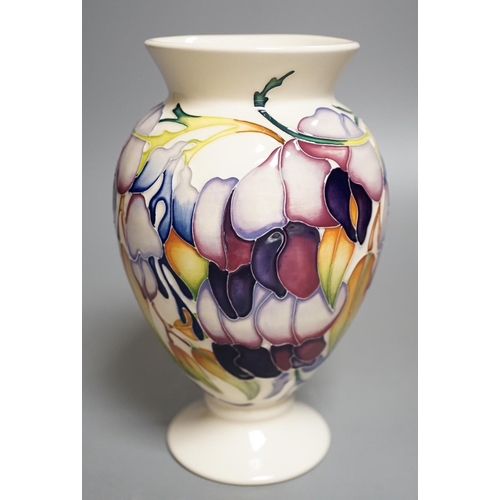 1429 - A Moorcroft 'purple wisteria' vase, 2013,17.5 cms high.