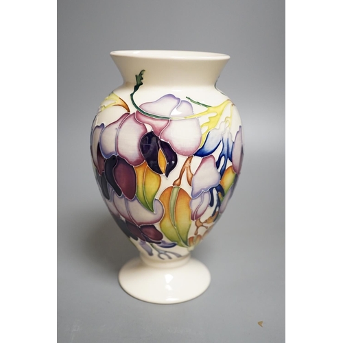 1429 - A Moorcroft 'purple wisteria' vase, 2013,17.5 cms high.