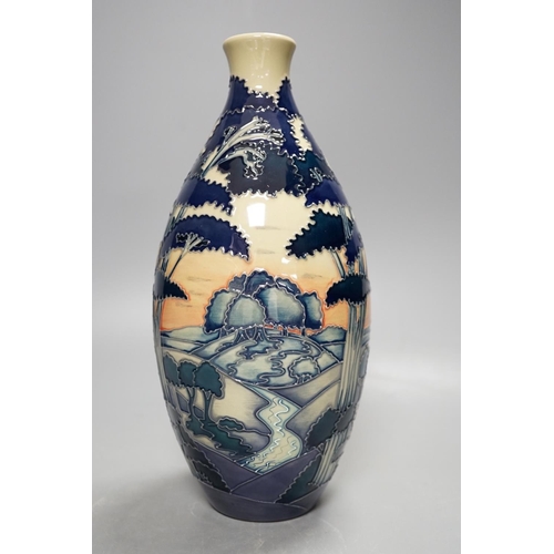 1444 - A Moorcroft 'trees in a landscape' trial vase, boxed,23cms high.