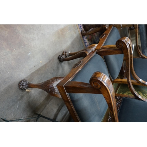 1076 - A pair of George II style burr walnut elbow chairs, on lions paw feet, width 58cm, depth 70cm, heigh... 