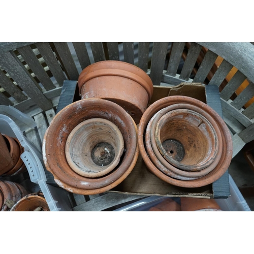 1080 - Approximately 100 terracotta garden pots, largest diameter 33cm height 28cm