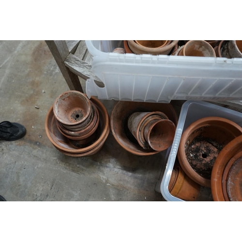 1080 - Approximately 100 terracotta garden pots, largest diameter 33cm height 28cm