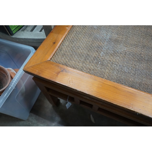 1083 - A Chinese caned pine and hardwood square low table, width 97cm height 51cm