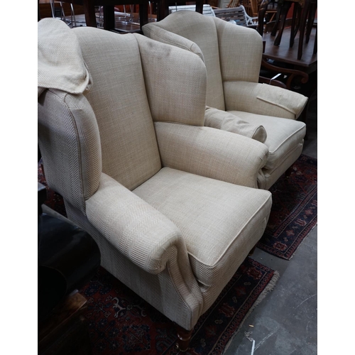 1085 - A pair of Duresta wing armchairs, upholstered in a natural herringbone fabric, width 92cm depth 80cm... 