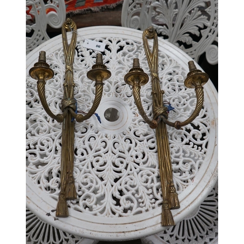 1090 - A pair of gilt metal two branch wall lights, height 64cm