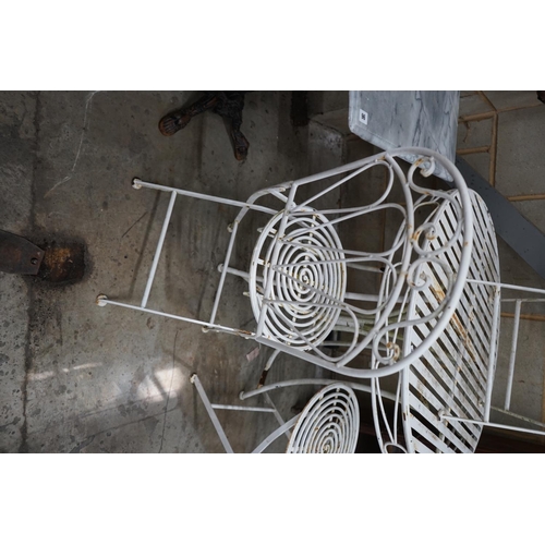 1097 - A circular metal garden table and three folding chairs, table diameter 90cm height 76cm