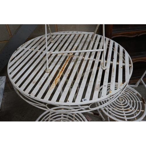 1097 - A circular metal garden table and three folding chairs, table diameter 90cm height 76cm