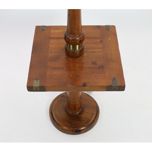 1107 - A pine and walnut standard lamp, with square mid tier, height 118cm