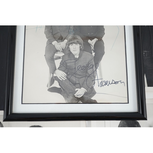 11 - An autographed Beatles photograph and four related photographs of the Beatles with Peter Aldersley A... 