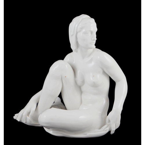 113 - Robert Ullmann (1903-1966) for Meissen, a white glazed porcelain figure of a seated female nude, blu... 