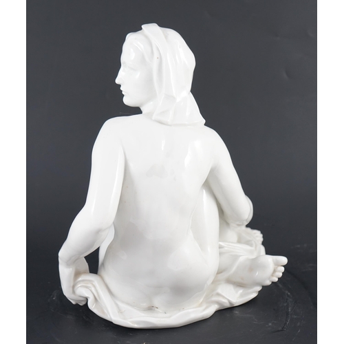 113 - Robert Ullmann (1903-1966) for Meissen, a white glazed porcelain figure of a seated female nude, blu... 