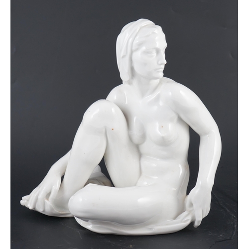 113 - Robert Ullmann (1903-1966) for Meissen, a white glazed porcelain figure of a seated female nude, blu... 