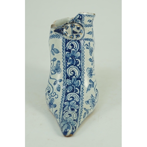 119 - A documentary English delftware blue and white model of a shoe, dated 1732, painted with bands of fl... 