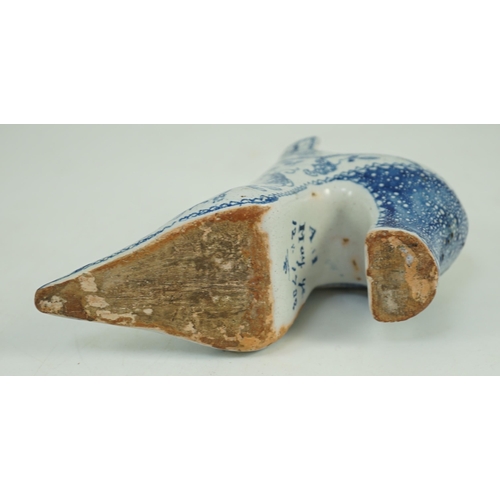 119 - A documentary English delftware blue and white model of a shoe, dated 1732, painted with bands of fl... 