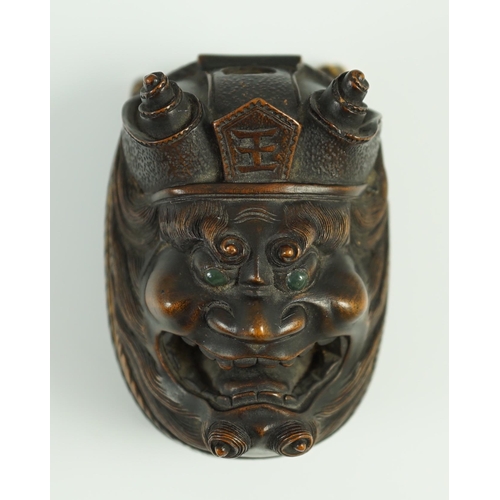 134 - An unusual Japanese double noh mask wood container, early 20th century, one side carved with Shoki t... 