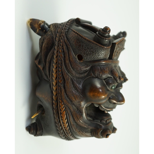 134 - An unusual Japanese double noh mask wood container, early 20th century, one side carved with Shoki t... 