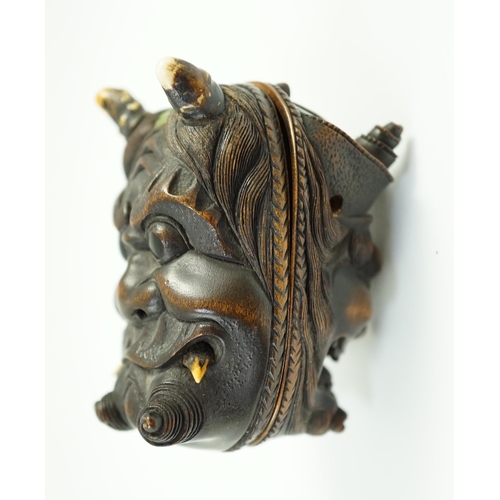 134 - An unusual Japanese double noh mask wood container, early 20th century, one side carved with Shoki t... 