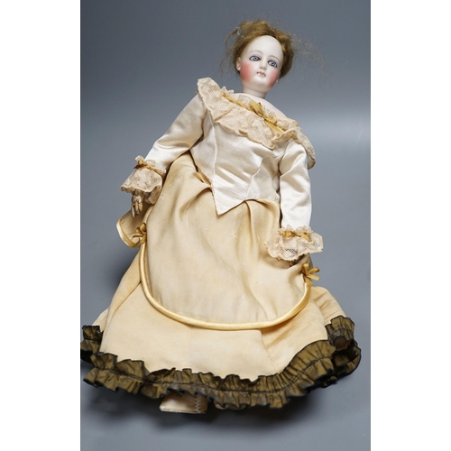 14 - An S.G. bisque shoulder head French fashion doll c.1875, cork pate mohair wig attached, swivel neck,... 