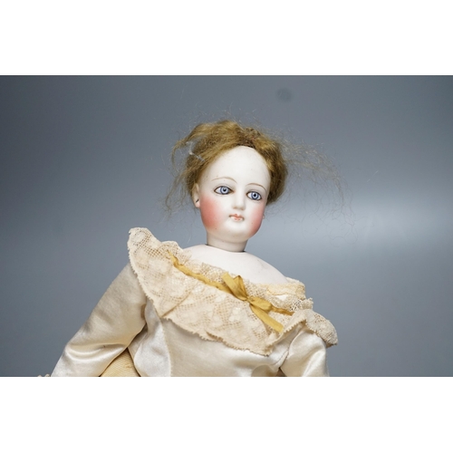 14 - An S.G. bisque shoulder head French fashion doll c.1875, cork pate mohair wig attached, swivel neck,... 