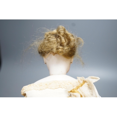 14 - An S.G. bisque shoulder head French fashion doll c.1875, cork pate mohair wig attached, swivel neck,... 